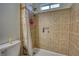 Bathroom featuring a tiled shower with dual shower heads and a built in niche at 260 Eastwood Forest, Covington, GA 30014