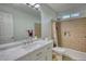 Bathroom featuring a double sink vanity and tiled shower with a tub at 260 Eastwood Forest, Covington, GA 30014