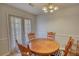 Eat-in dining area with a round wood table and seating for four at 260 Eastwood Forest, Covington, GA 30014