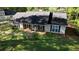 Traditional single story home with a covered front porch, shutters and beautiful lawn at 260 Eastwood Forest, Covington, GA 30014