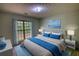 Stylishly staged main bedroom with a large bed, modern furniture, and natural light at 260 Eastwood Forest, Covington, GA 30014