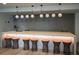 Stylish bar area with a long countertop, modern lighting, and comfortable seating for a chic entertaining space at 3324 Peachtree Ne Rd # 1518, Atlanta, GA 30326