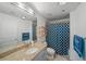 Well-lit bathroom featuring a granite countertop, blue shower curtain, and matching towel at 3324 Peachtree Ne Rd # 1518, Atlanta, GA 30326
