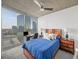 Cozy bedroom with floor-to-ceiling windows showcasing city views and modern ceiling fan at 3324 Peachtree Ne Rd # 1518, Atlanta, GA 30326