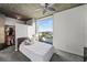 Serene bedroom featuring a large window with city views, soft lighting, and a well-organized walk-in closet at 3324 Peachtree Ne Rd # 1518, Atlanta, GA 30326