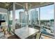 Modern dining room featuring floor to ceiling windows providing breathtaking city views and a stylish chandelier at 3324 Peachtree Ne Rd # 1518, Atlanta, GA 30326