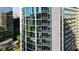 Exterior view of high-rise condo building with unit highlighted, showcasing modern architecture and glass windows at 3324 Peachtree Ne Rd # 1518, Atlanta, GA 30326