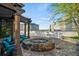Inviting outdoor fire pit area with comfortable seating, pergola, and scenic city views for relaxing evenings at 3324 Peachtree Ne Rd # 1518, Atlanta, GA 30326
