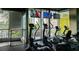 Bright gym equipped with modern cardio machines, floor-to-ceiling windows with city views, and mounted TVs at 3324 Peachtree Ne Rd # 1518, Atlanta, GA 30326