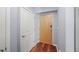 Hallway view with wood floors, modern doors and neutral paint at 3324 Peachtree Ne Rd # 1518, Atlanta, GA 30326