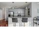 Contemporary kitchen with stainless steel appliances, breakfast bar, and stylish pendant lighting at 3324 Peachtree Ne Rd # 1518, Atlanta, GA 30326