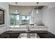 Stylish kitchen featuring a breakfast bar, granite countertops, and views of the dining area at 3324 Peachtree Ne Rd # 1518, Atlanta, GA 30326