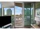Bright living room with sliding glass doors and city views at 3324 Peachtree Ne Rd # 1518, Atlanta, GA 30326