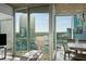 Bright living space featuring hardwood floors, large windows with city views, and comfortable seating at 3324 Peachtree Ne Rd # 1518, Atlanta, GA 30326