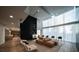 Open-concept lobby with modern furniture, tall curtains, and a high ceiling, creating a welcoming and bright space at 3324 Peachtree Ne Rd # 1518, Atlanta, GA 30326