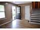 Inviting foyer with wood floors, natural light, and an open doorway at 3867 Cherie Glen Rd, Snellville, GA 30039