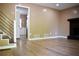 The spacious living room has wood floors, neutral walls and a fireplace at 3867 Cherie Glen Rd, Snellville, GA 30039