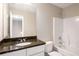 Bathroom boasts a vanity with granite countertop, a large mirror, and a shower and tub combo at 960 Revere Way, Hampton, GA 30228