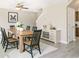 Dining area with a stylish wood table, chairs, and an elegant buffet at 960 Revere Way, Hampton, GA 30228