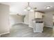 Open-concept floorplan with modern hardwood floors and the kitchen visible from the living room at 960 Revere Way, Hampton, GA 30228