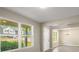 Bright living room showcasing large windows, modern paint, wood-look floors, and an open floor plan at 960 Revere Way, Hampton, GA 30228