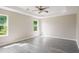 Bright main bedroom boasts large windows offering views of the outdoor landscape at 960 Revere Way, Hampton, GA 30228