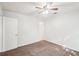 Cozy bedroom featuring a ceiling fan and neutral walls at 1066 Rock Creek Ln, Norcross, GA 30093