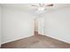 Bedroom with a ceiling fan, a white door, and neutral walls at 1066 Rock Creek Ln, Norcross, GA 30093