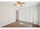Bedroom features a closet and ceiling fan at 1066 Rock Creek Ln, Norcross, GA 30093
