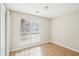 Cozy bedroom featuring light-filled window and neutral walls at 1066 Rock Creek Ln, Norcross, GA 30093