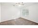 Clean bedroom with ceiling fan and neutral carpet at 1066 Rock Creek Ln, Norcross, GA 30093
