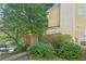 Charming exterior view with mature trees and manicured landscaping at 1066 Rock Creek Ln, Norcross, GA 30093