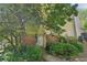 Inviting home exterior with mature trees and lush greenery in the front yard at 1066 Rock Creek Ln, Norcross, GA 30093