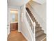 Hallway featuring a carpeted staircase and access to a bathroom at 1066 Rock Creek Ln, Norcross, GA 30093