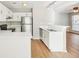 Well-lit kitchen with stainless steel refrigerator and white cabinets at 1066 Rock Creek Ln, Norcross, GA 30093