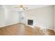 Bright living room with a decorative fireplace and wood-look flooring at 1066 Rock Creek Ln, Norcross, GA 30093