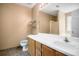 Bathroom with white countertop vanity, large mirror, and tiled floors at 11268 Flat Shoals Rd, Covington, GA 30016