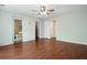 Expansive bedroom with hardwood flooring featuring multiple doors and closet access at 11268 Flat Shoals Rd, Covington, GA 30016