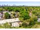 Aerial view showcases property with lush greenery and skyline in the distance at 1570 Dekalb Ne Ave # F, Atlanta, GA 30307