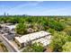 Aerial view of property nestled among lush greenery with city skyline in the background at 1570 Dekalb Ne Ave # F, Atlanta, GA 30307
