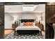 Bedroom with neutral decor, barn door access, and a gray-and-white patterned rug at 1570 Dekalb Ne Ave # F, Atlanta, GA 30307