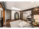 Cozy bonus room with hardwood floors, a skylight, and gray armchairs overlooking the entry to the bedroom at 1570 Dekalb Ne Ave # F, Atlanta, GA 30307
