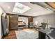 Bonus room with modern decor, hardwood floors, and barn door entry to bedroom at 1570 Dekalb Ne Ave # F, Atlanta, GA 30307