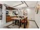 Open floor plan living with dining area, modern light fixture, and neutral decor at 1570 Dekalb Ne Ave # F, Atlanta, GA 30307