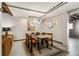 Open floor plan living with dining area, modern light fixture, and neutral decor at 1570 Dekalb Ne Ave # F, Atlanta, GA 30307