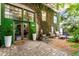 Beautiful front entrance with green accents, greenery, and an inviting outdoor seating area at 1570 Dekalb Ne Ave # F, Atlanta, GA 30307