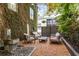 Charming outdoor patio area with stylish seating and a relaxing water feature at 1570 Dekalb Ne Ave # F, Atlanta, GA 30307