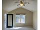 Vaulted ceiling bedroom with an exterior door and window at 2127 Manhattan Pkwy, Decatur, GA 30035