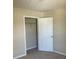 Bedroom showcasing a closet and neutral carpet at 2127 Manhattan Pkwy, Decatur, GA 30035