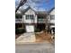 Beautiful townhome featuring a front-facing garage and lovely landscaping at 2127 Manhattan Pkwy, Decatur, GA 30035